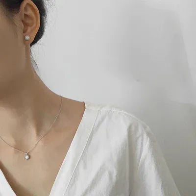Opal jewelry necklace worn around a woman's neck