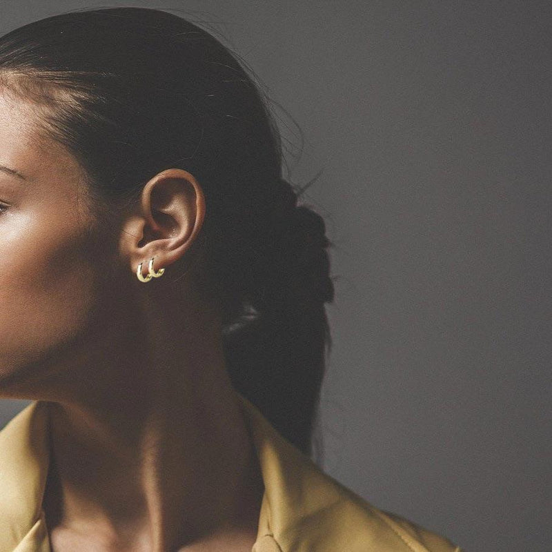 Small Gold Hoop Earrings On A Woman