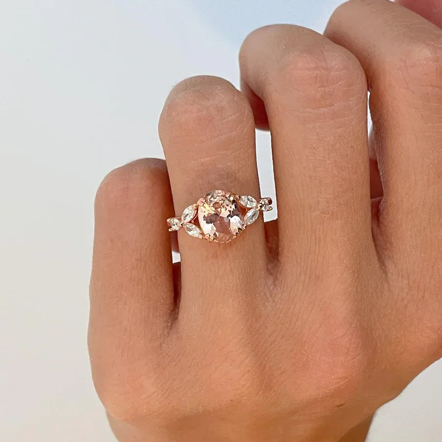 Elegant morganite jewelry ring with a large, oval-cut morganite gemstone set
