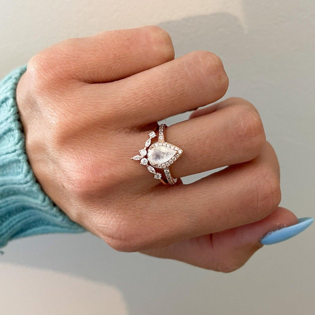 Stacked moonstone ring on woman's hand