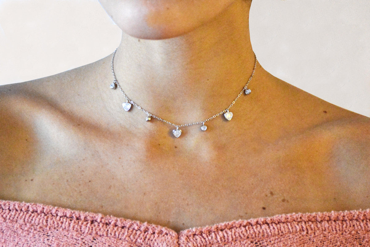 Silver Heart Charm Neckace On A Woman