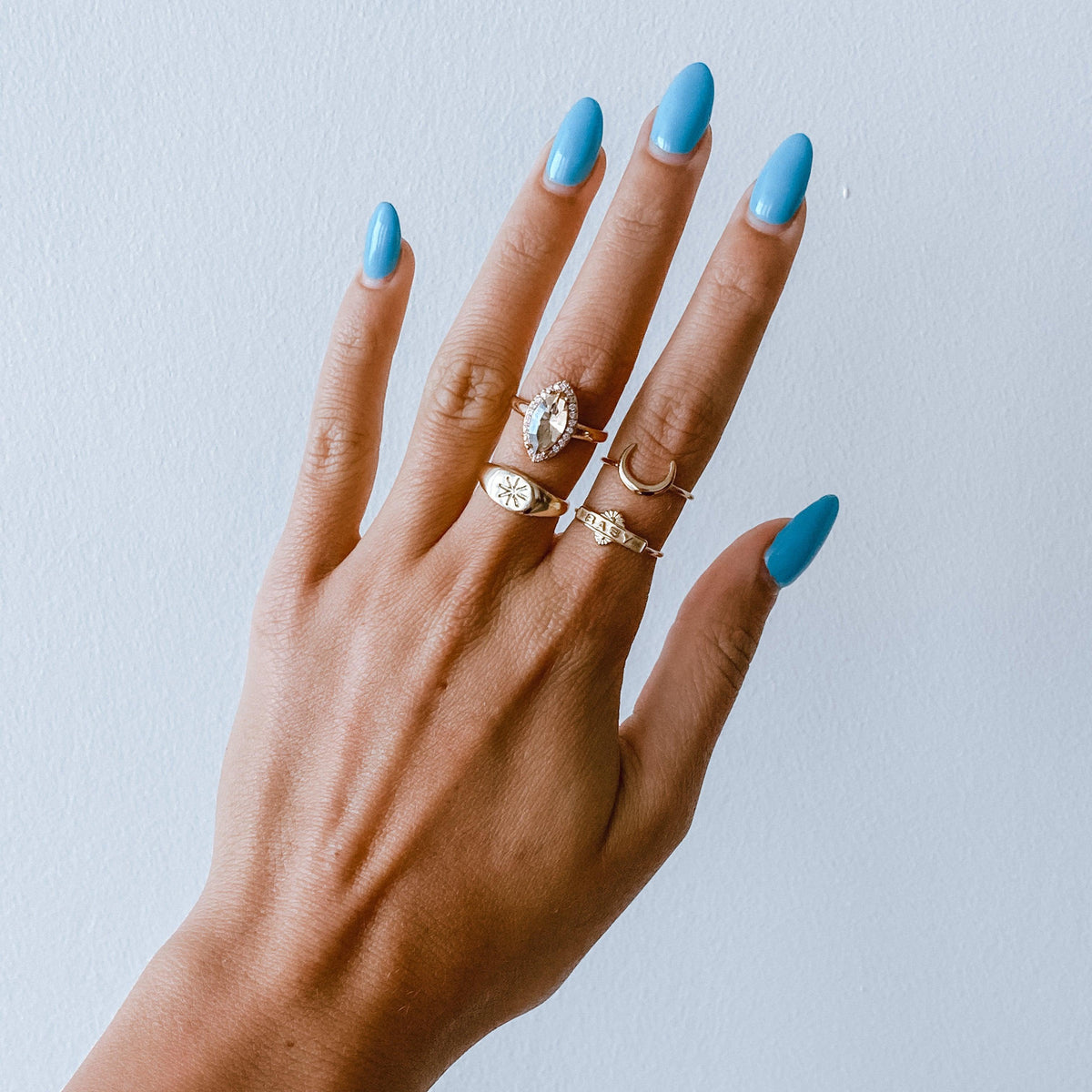 A Woman Wearing A 925 Sterling Silver Stackable Sun Ring